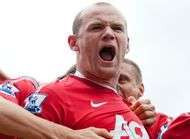 Rooney menace un supporter de le frapper